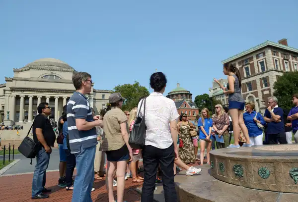 A student leader gives an admissions tour in the center of campus, Columbia University, August 8, 2014.