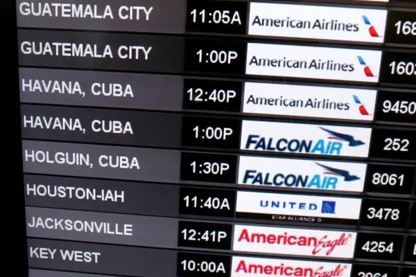 Travelers Check In To Flight To Havana, Cuba From Miami