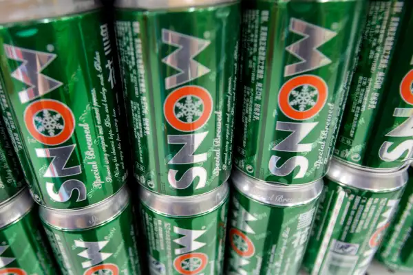 Cans of Snow beer, a brand by SABMiller Plc, sit on a shelf