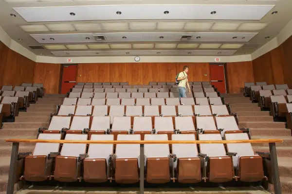 student walking out of classroom