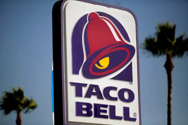 Signage is displayed outside of a Taco Bell restaurant, in Redondo Beach, California, on Oct. 4, 2013.