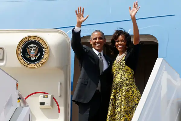 U.S. President Barack Obama and first lady Michelle Obama wave from Air Force One as they depart Dakar, Senegal, June 28, 2013.