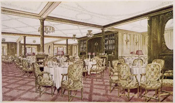 The first class dining room of the White Star liner 'Titanic', circa 1912.