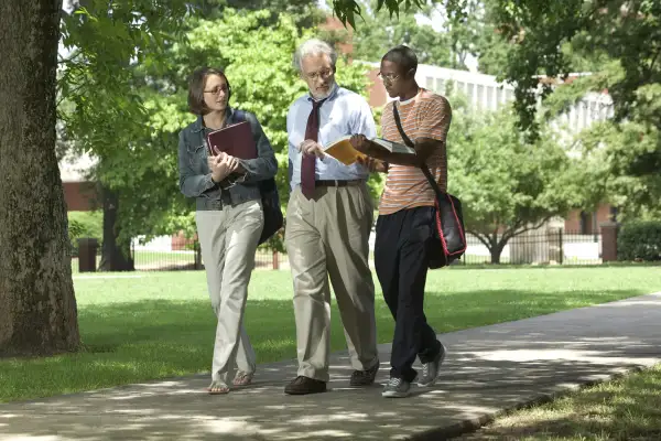 professor walking with students