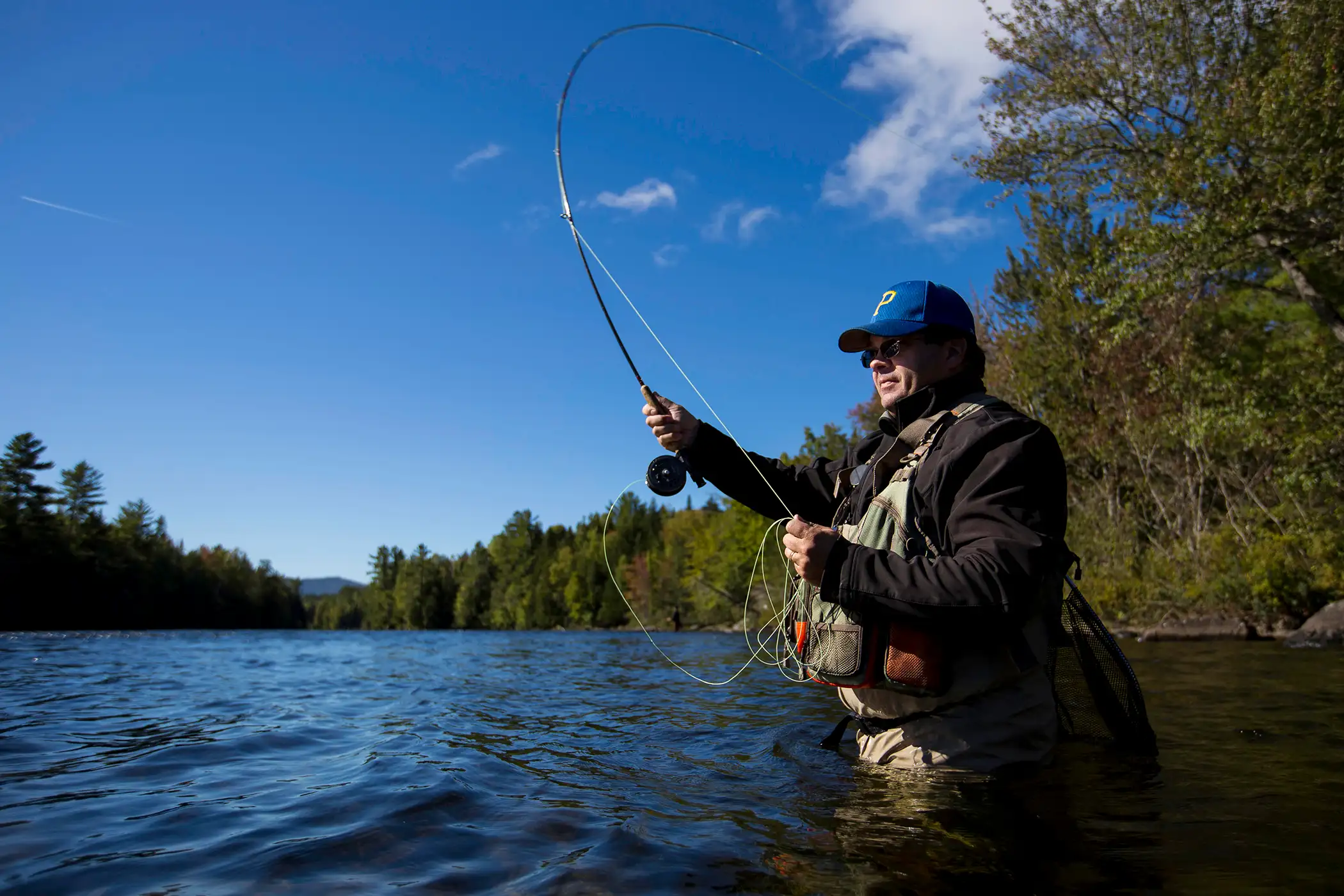 Tim Richardson, of Dover-Foxcroft, casts a line into the Kennebec River, September 26, 2015.