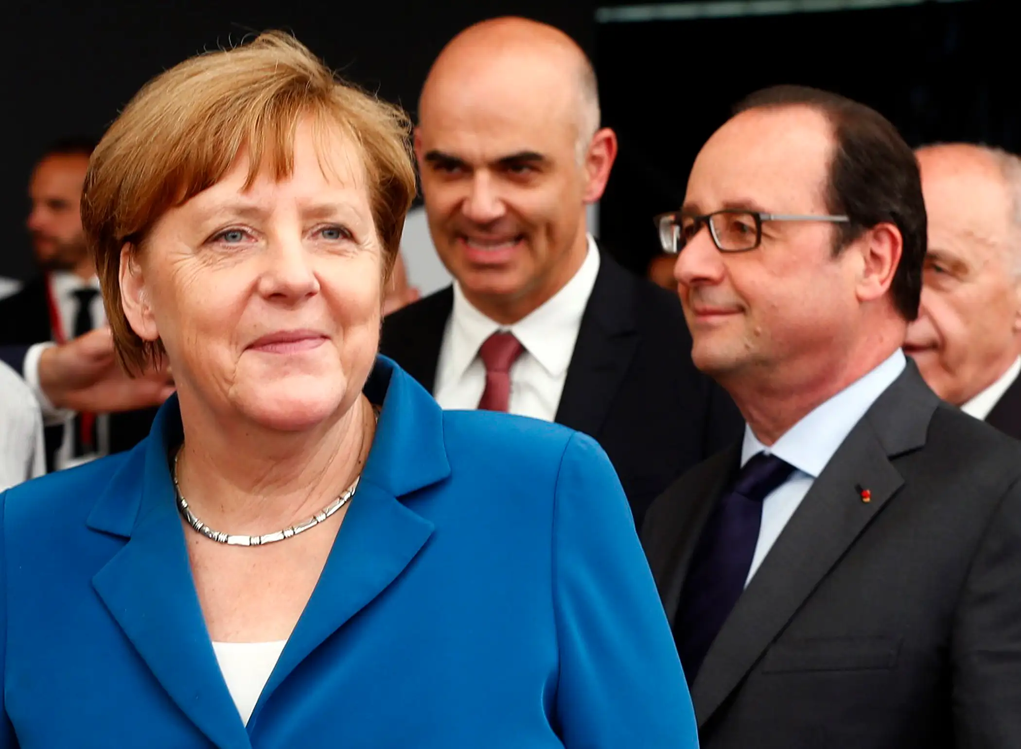 (L-R) German Chancellor Angela Merkel, Swiss Interior Minister Alain Berset and French President Francois Hollande arrive in Pollegio for the opening ceremony of the NEAT Gotthard Base Tunnel, the world's longest and deepest rail tunnel, Switzerland June 1, 2016.