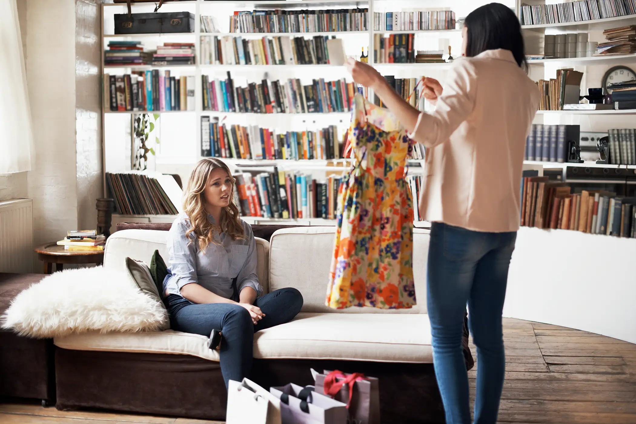 stylist showing clothes to client