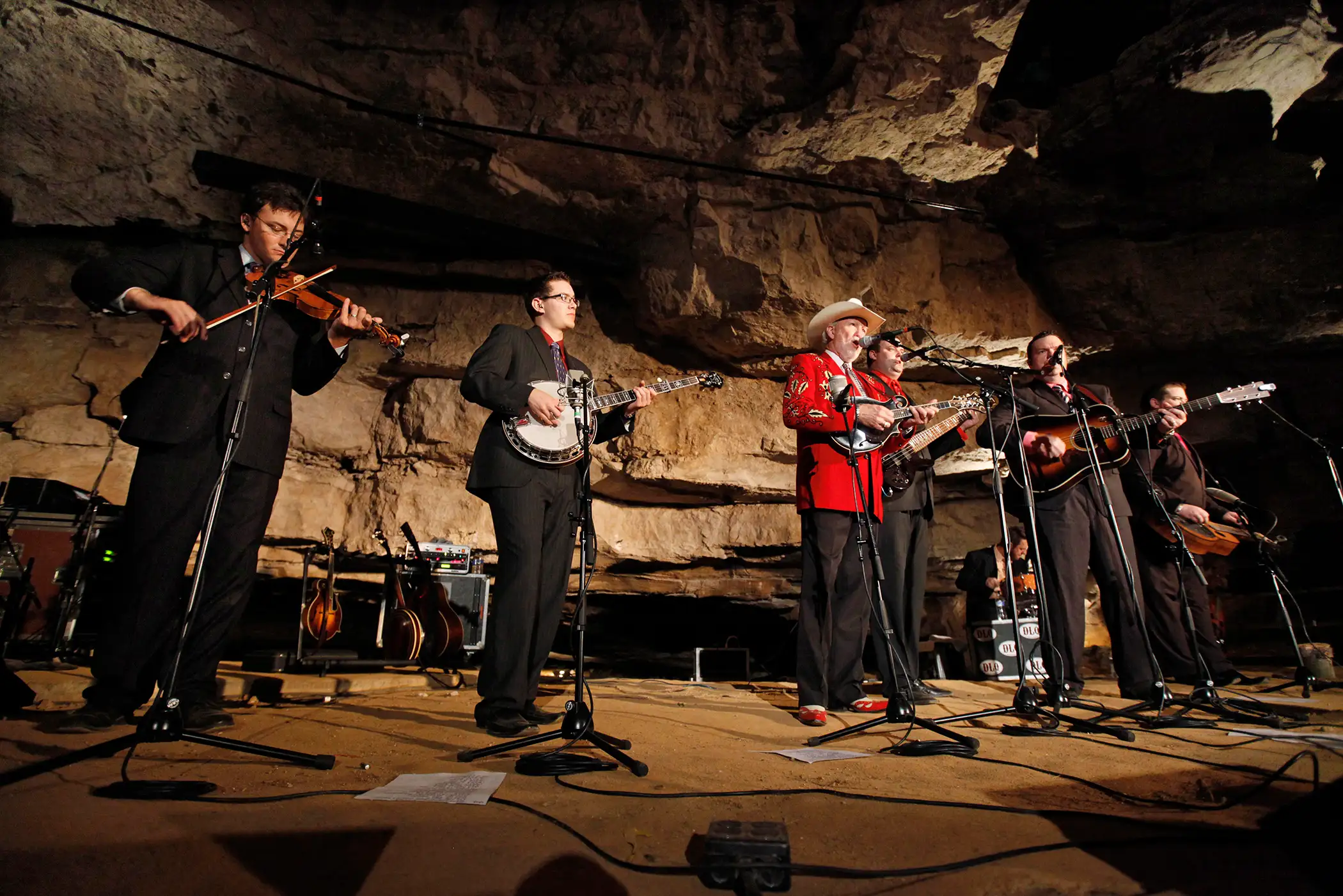 In this July 26, 2011 photo, Doyle Lawson, center, and Quicksilver perform in the Volcano Room at Cumberland Caverns, 333 feet below ground, in McMinnville, Tenn. The natural ampitheater is where the Bluegrass Underground radio show is broadcast from once a month.
