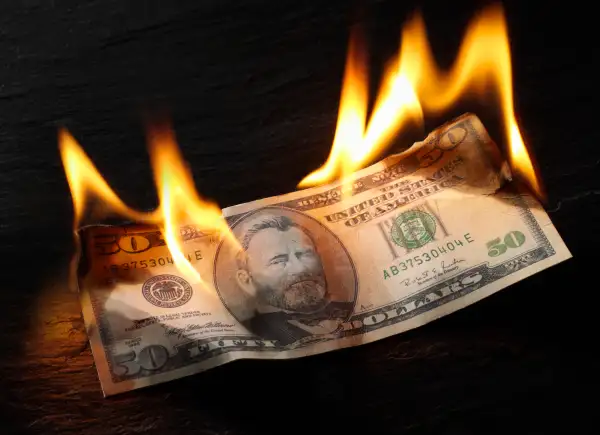 Burning 50 dollar bill