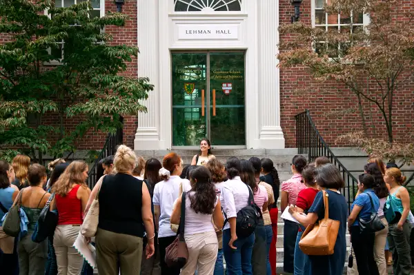 Sophomore student leads introductory tour on steps of Lehmen Hall Old Harvard Yard Harvard University Cambridge MA