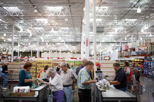 Customers stand at check out counters after shopping inside a Costco Wholesale Corp. store in Nashville, on Sept. 25, 2015.