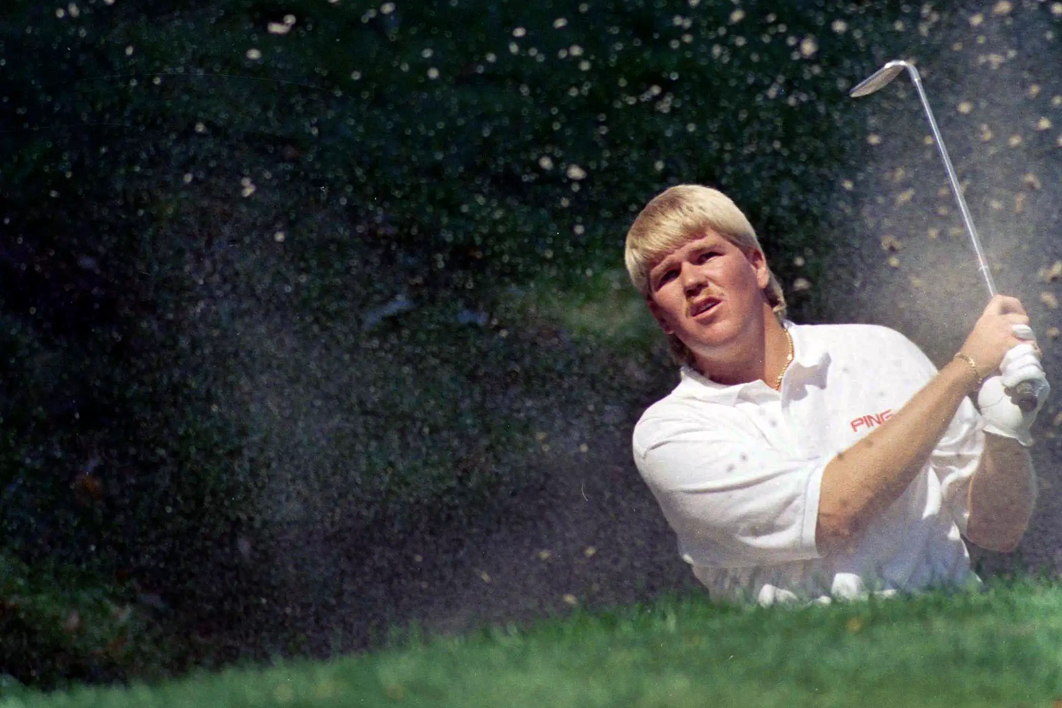 John Daly of Memphis, Tenn., blasts one out of a trap on the ninth hole during third round action at the PGA Championship Carmel, Indiana on Saturday, August 10, 1991.