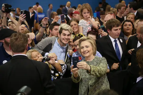 Democratic presidential candidate Hillary Clinton takes cell phone photographs with people during a campaign stop at the Douglass Park Gynasium on May 1, 2016 in Indianapolis, Indiana.