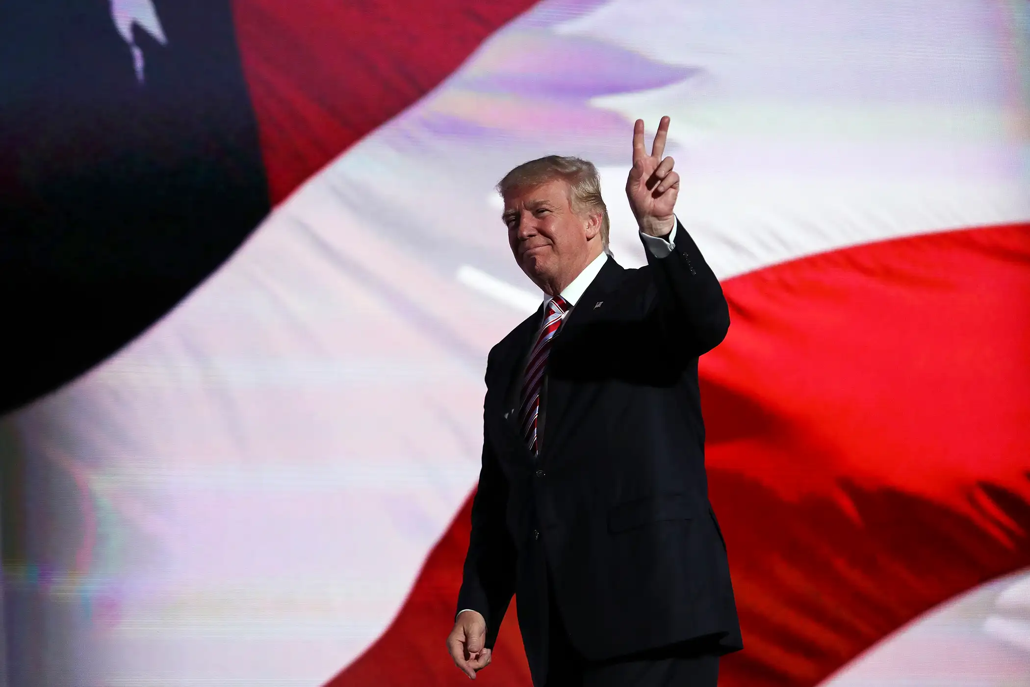 Republican presidential candidate Donald Trump gestures after Republican vice presidential candidate Mike Pence delivered his speech on the third day of the Republican National Convention on July 20, 2016 at the Quicken Loans Arena in Cleveland, Ohio.