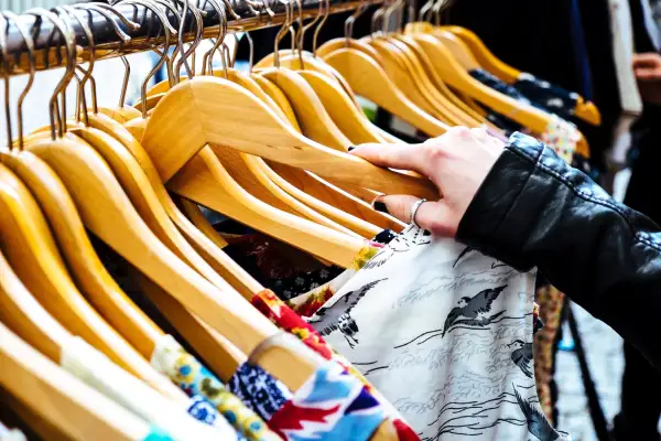 hand on clothing rack