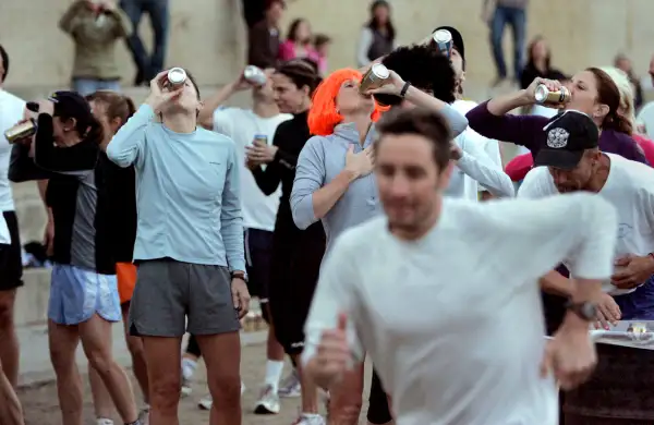 A group of athletes, headed by some of the areas top triathletes, celebrated the New Year by participating in an event called the Beer Mile, Dec. 28, 2006, Encinitas, CA. . Each participant must chug a beer before running each of the 4 laps in the mile race.