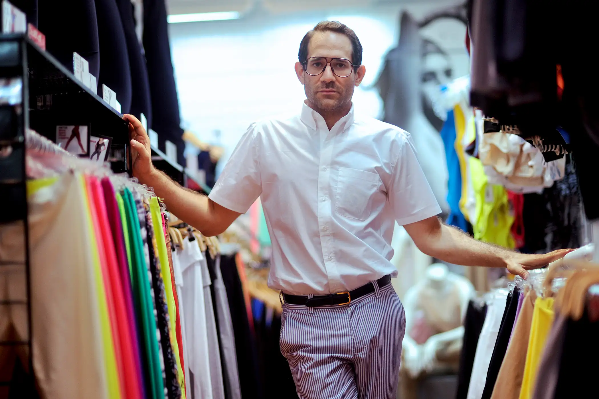 Dov Charney, chairman and chief executive officer of American Apparel Inc., stands for a portrait in a company retail store in New York, U.S., on Thursday, July 29, 2010. Starting the company in a dorm at Tufts University in Medford, Massachusetts, Charney built a worldwide empire of 280 clothing stores by leaping out ahead of mainstream fashion. He personified the racy, risk-taking aesthetics of his business and is now facing the consequences - skittish lenders and investors who doubt his ability to oversee his own creation.