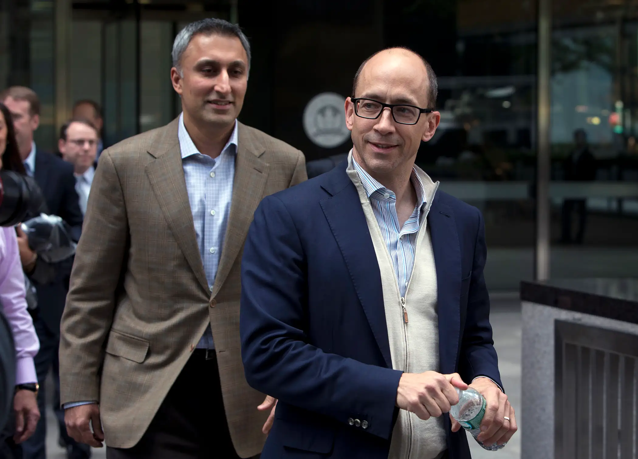 Mike Gupta, chief financial officer of Twitter Inc., left, and Richard  Dick  Costolo, chief executive officer of Twitter Inc., exit JPMorgan Chase &amp; Co. headquarters in New York, U.S., on Friday, Oct. 25, 2013. Twitter Inc. will make the case to potential investors in its initial public offering that it needs to keep spending to grow, and profit will come once it can reap the benefits of those investments.