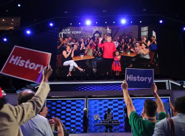 Democratic presidential nominee Hillary Clinton delivers remarks via a video screen on the second day of the 2016 Democratic National Convention at Wells Fargo Center on July 26, 2016 in Philadelphia, Pennsylvania.