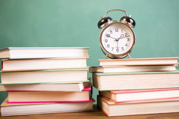 clock on top of books