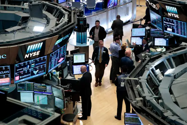 Traders and financial professionals work on the floor of the New York Stock Exchange (NYSE), July 12, 2016 in New York City.