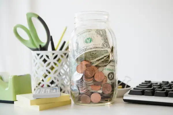 jar of money on desk
