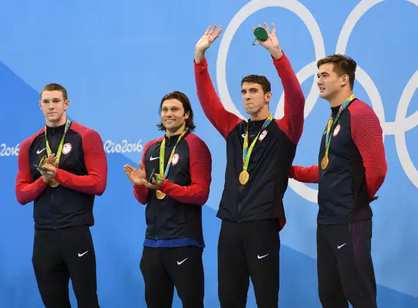 From left to right, United States' Ryan Murphy, Cody Miller, Michael Phelps and Nathan Adrian stand for the medal ceremony for the men's 4 x 100-meter medley relay final during the swimming competitions at the 2016 Summer Olympics, Sunday, Aug. 14, 2016, in Rio de Janeiro, Brazil.