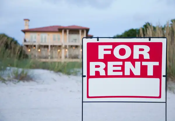 for rent  sign outside of beach home