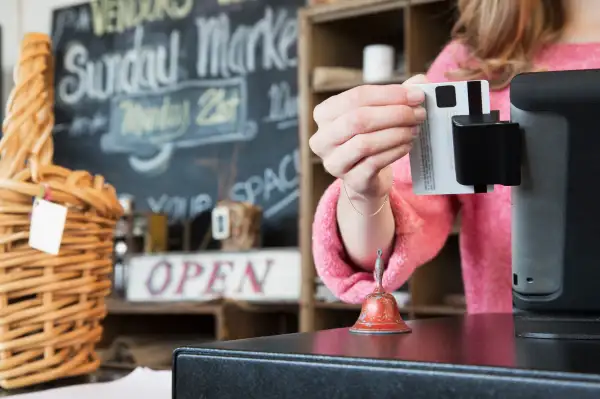 Credit card being swiped in small business