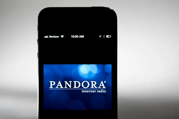 The Pandora logo is seen on an Apple Inc. iPhone displayed for a photograph in Washington, D.C., on Sept. 17, 2013.