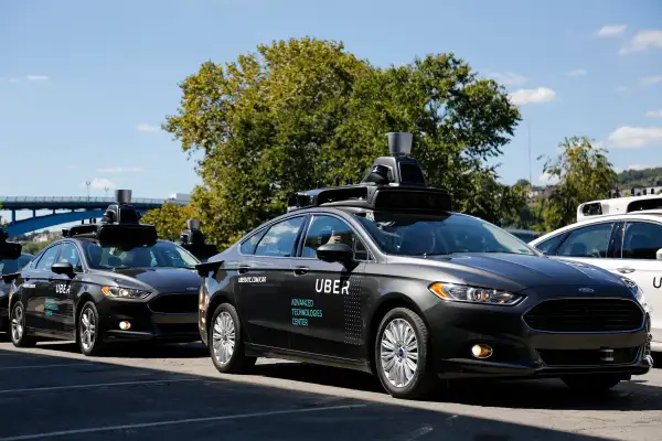 A group of self driving Uber vehicles position themselves to take journalists on rides during a media preview at Uber's Advanced Technologies Center in Pittsburgh, Monday, Sept. 12, 2016.
