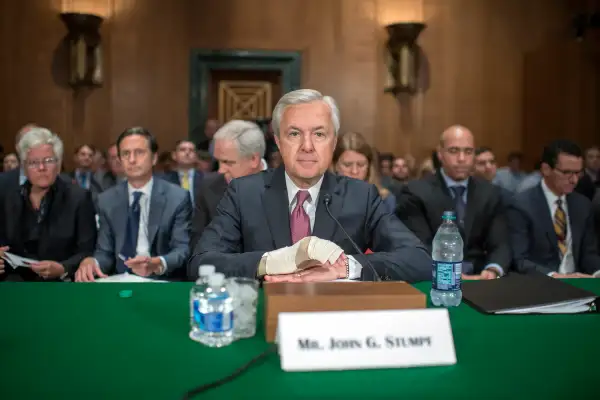 Wells Fargo CEO John Stumpf, center, prepares to testify at a Senate Banking, Housing, and Urban Affairs hearing in Dirksen Building, September 20, 2016, on the company's unauthorized accounts opened under customers' names.
