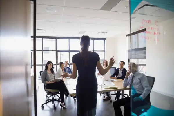 Businesswoman leading meeting in conference room