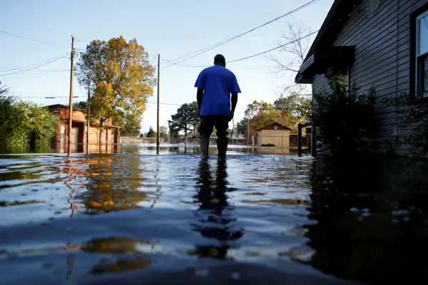 Eric McClary of West Mulberry Lane checks flood levels while checking on his flooded home after the effects of Hurricane Matthew in Goldsboro, North Carolina, October 12, 2016.