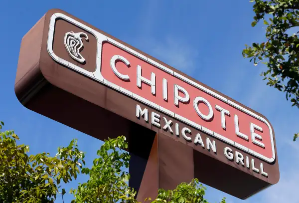 This Monday, Feb. 8, 2016, photo, shows the sign of a Chipotle restaurant in Hialeah, Fla.