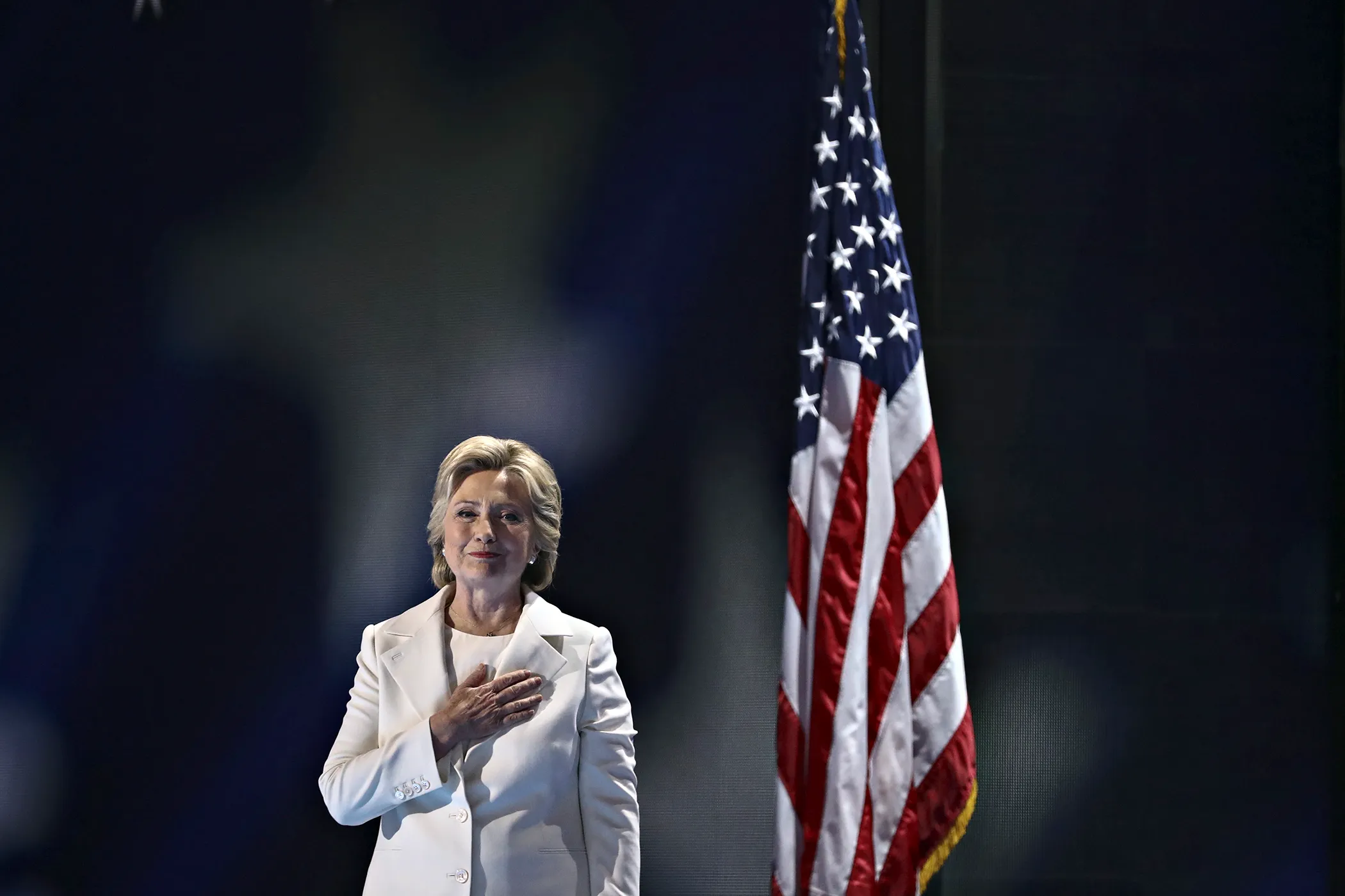 Hillary Clinton, 2016 Democratic presidential nominee, holds a hand over her heart while arriving to speak during the Democratic National Convention (DNC) in Philadelphia, Pennsylvania, U.S., on Thursday, July 28, 2016.