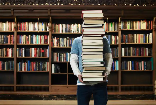 Student burdened with books.