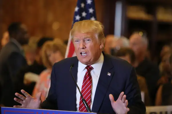 Presidential candidate Donald Trump gestures in a press