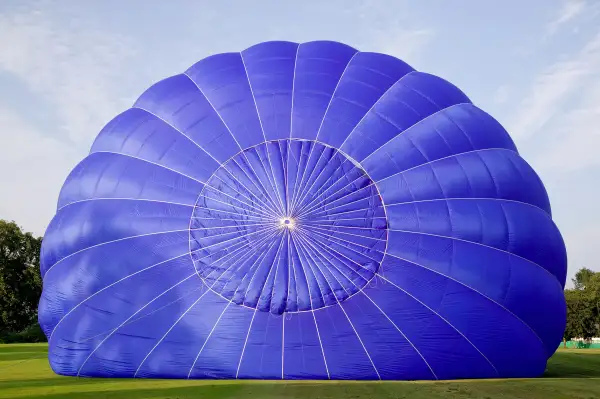 Hot air balloon being inflated on the ground