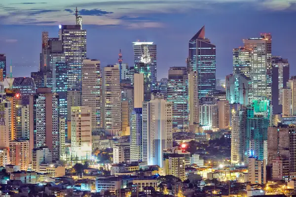 Asia, South East Asia, Philippines, Manila, Intramuros, view of Makati and the business district at dusk.