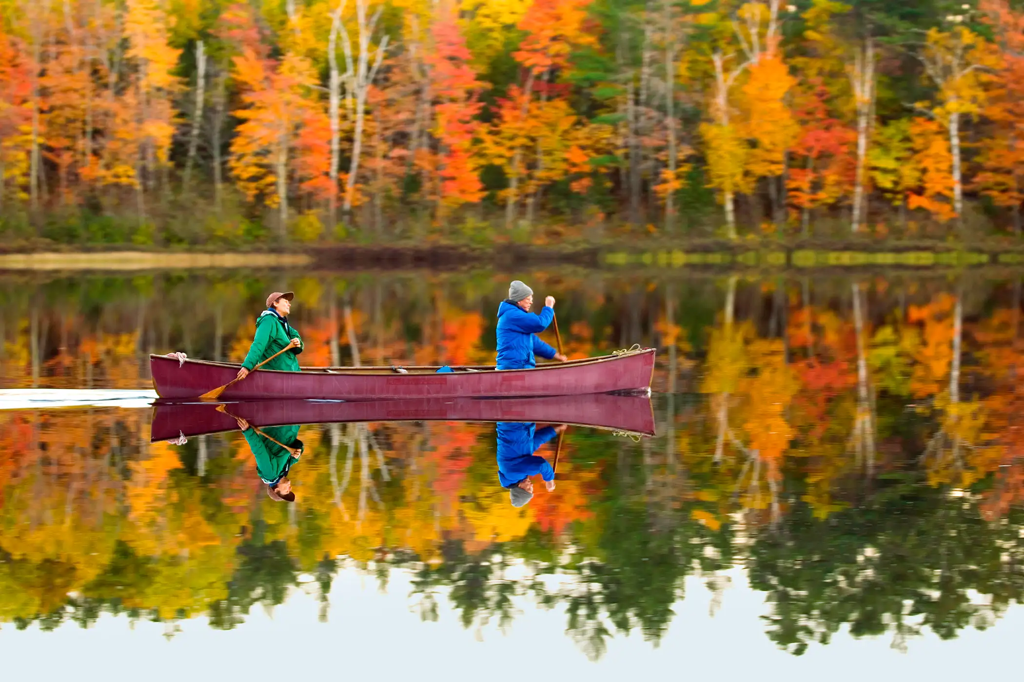 A pair of canoeists paddle