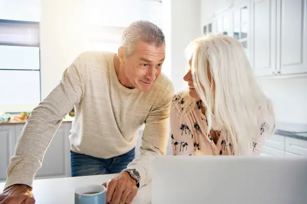 Older couple looking at computer.