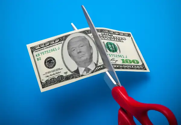 Trump on 100 dollar bill being cut in half
