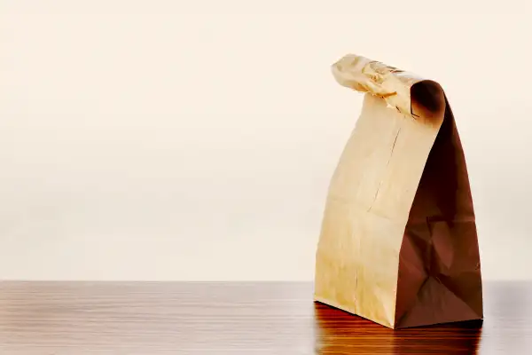 Brown lunch bag on table