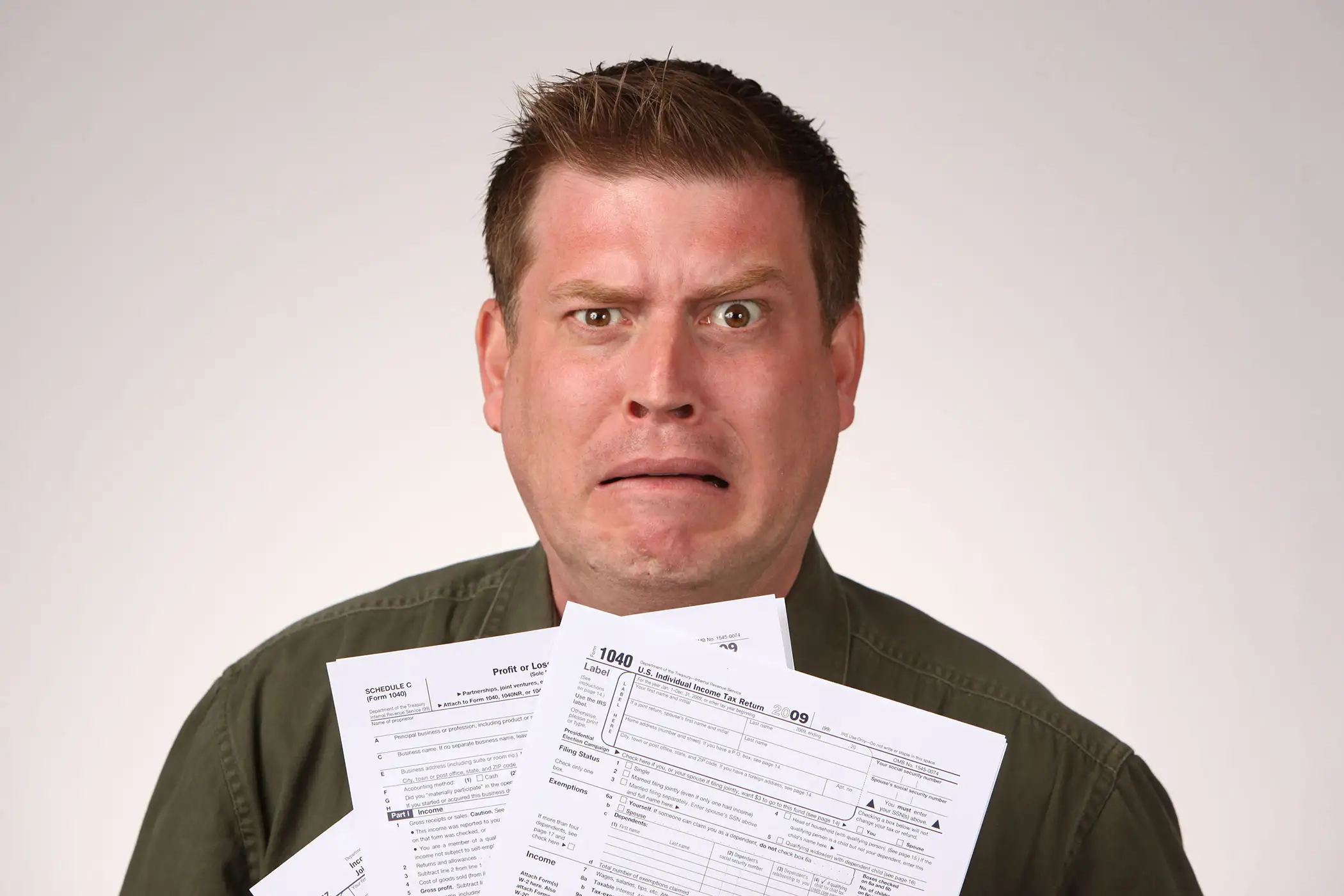 Middle aged man feeling a Little Anxious about his taxes