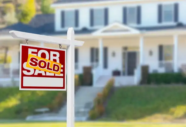 Sold Home For Sale Sign in Front of New House