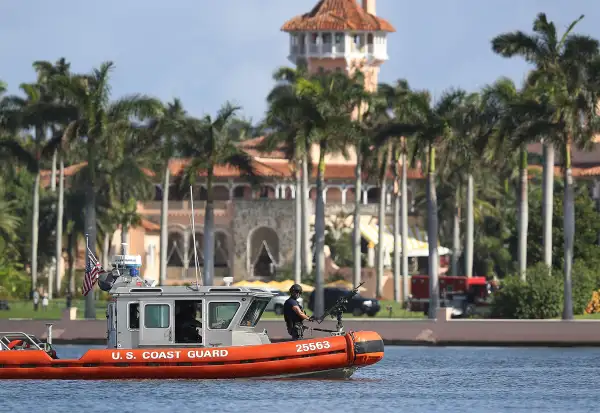 A U.S. Coast Guard boat passes in front of the Mar-a-Lago Resort where President-elect Donald Trump is staying as the 538 members of the Electoral College are set to make his election victory official on December 19, 2016 in Palm Beach, Florida.