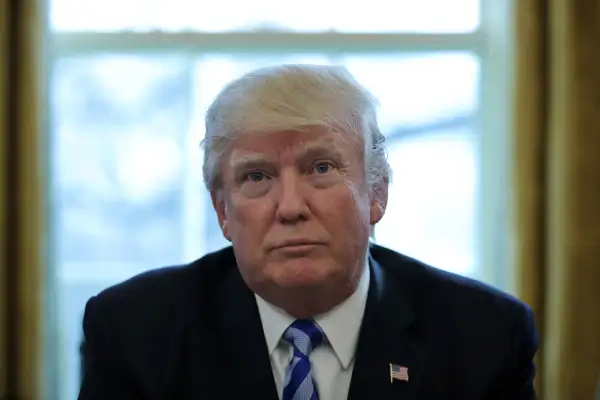 U.S. President Donald Trump talks to journalists at the Oval Office of the White House after the AHCA health care bill was pulled before a vote in Washington, U.S. March 24, 2017.