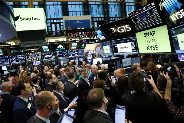 Traders on the floor of the New York Stock Exchange (NYSE) wait for Snap Inc to post their IPO in New York, March 2, 2017.