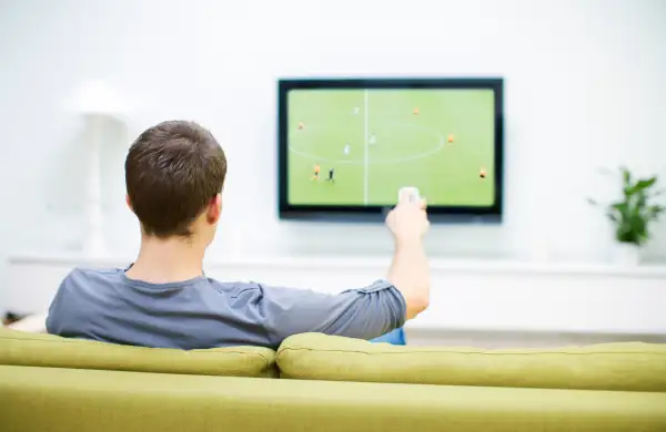 Man watching football on television